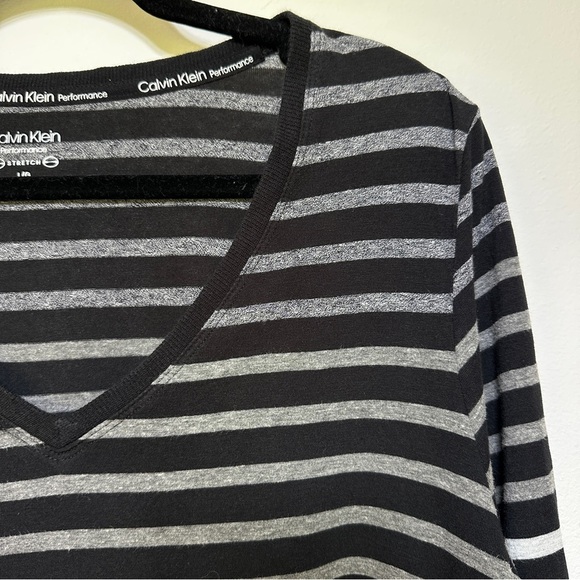 Calvin Klein | V-Neck Black & White Striped Performance Top - Picture 2 of 5
